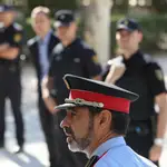 Josep Lluis Trapero, the head of Catalan police, walks past National Police officers as he leaves the Spain&#39;s High Court after testifying for the alleged crime of sedition in relation to arrests of high-ranking officials over the organisation of a banned independence vote in Madrid, Spain, October 6, 2017. REUTERS/Sergio Perez