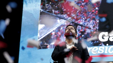 Chile's President elect Gabriel Boric, of the "I approve Dignity" coalition, celebrates his victory in the presidential run-off election , in Santiago, Chile, Sunday, Dec. 19, 2021. (AP Photo/Luis Hidalgo)