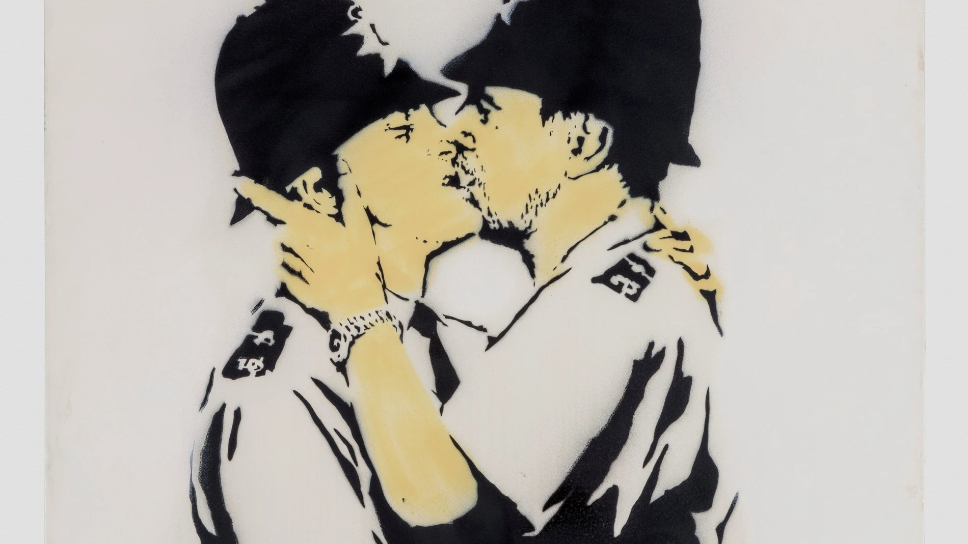 Fotografía de la obra "Kissing Coopers" del artista británico Banksy