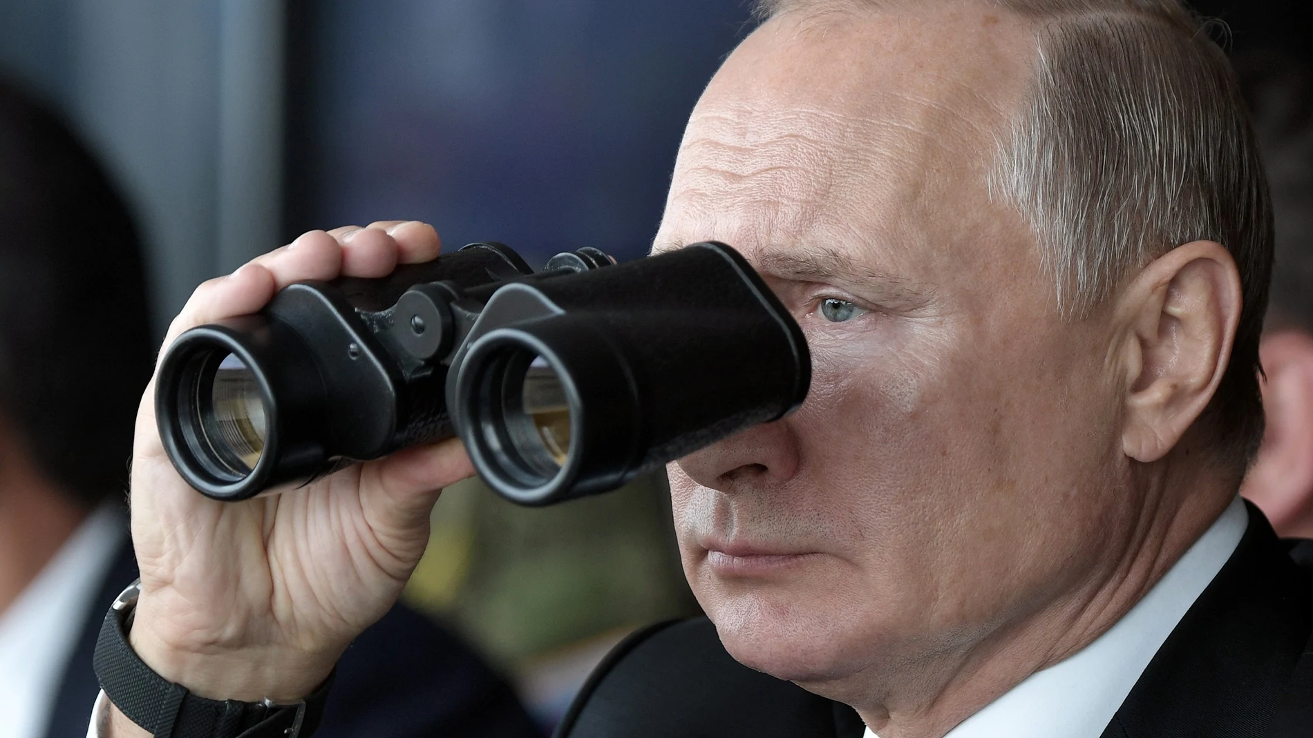 FILE - Russian President Vladimir Putin holds binoculars while watching the military exercises Center-2019 at Donguz shooting range near Orenburg, Russia, on Sept. 20, 2019. Russia's present demands are based on Putin's purported long sense of grievance and his rejection of Ukraine and Belarus as truly separate, sovereign countries but rather as part of a Russian linguistic and Orthodox motherland. (Alexei Nikolsky, Sputnik, Kremlin Pool Photo via AP, File)