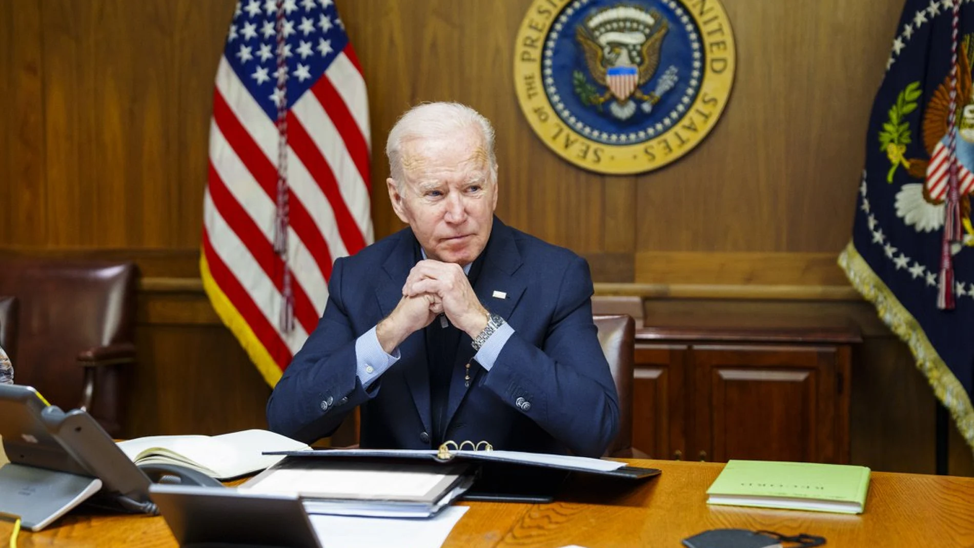This image provided by The White House via Twitter shows President Joe Biden at Camp David, Md., Saturday, Feb. 12, 2022. Biden on Saturday again called on President Vladimir Putin to pull back more than 100,000 Russian troops massed near Ukraineâ€™s borders and warned that the U.S. and its allies would â€œrespond decisively and impose swift and severe costsâ€ if Russia invades, according to the White House. (The White House via AP)