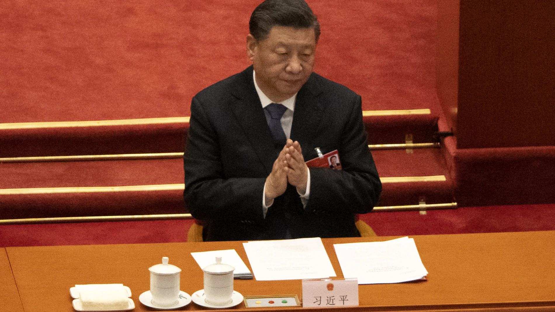 Chinese President Xi Jinping applauds during the closing session of China's National People's Congress (NPC) at the Great Hall of the People in Beijing, Friday, March 11, 2022. (AP Photo/Sam McNeil)