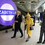 Britain&#39;s Queen Elizabeth II and Prince Edward, right, talks with Transport for London commissioner Andy Byford, left, at Paddington station in London meets staff of the Crossrail project, as well as Elizabeth Line staff who will be running the railway, to mark the completion of London&#39;s Crossrail project, Tuesday, May 17, 2022. (Andrew Matthews/Pool via AP)
