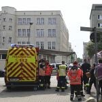 Emergency forces stand near a school in Bremerhaven, Germany, Thursday, May 19, 2022. German police say they have detained a suspect in connection with an attack at a high school in the northern city of Bremerhaven in which one person was injured. Police said the incident happened Thursday morning at the Lloyd high school in the center of the city. (Sina Schuldt/dpa via AP)