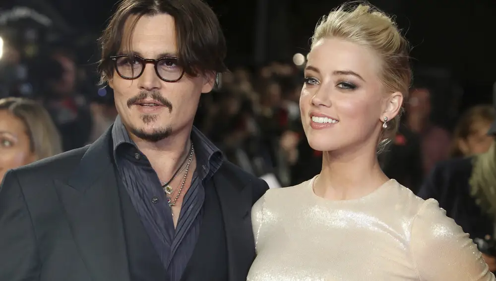 Amber Heard y Johnny Depp, cuando eran un matrimonio feliz (AP Photo/Joel Ryan, File)