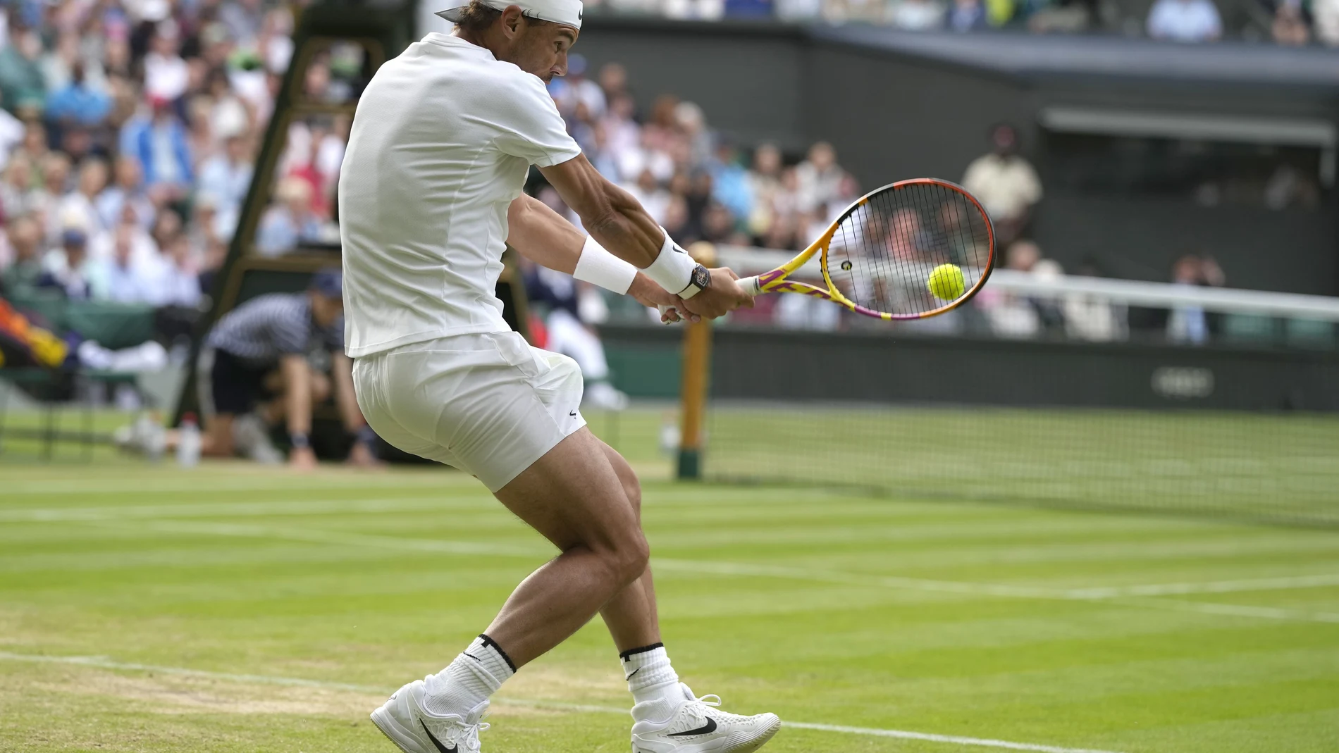 Spain's Rafael Nadal returns the ball to Italy's Lorenzo Sonego during a third round men's singles match on day six of the Wimbledon tennis championships in London, Saturday, July 2, 2022. (AP Photo/Alastair Grant)