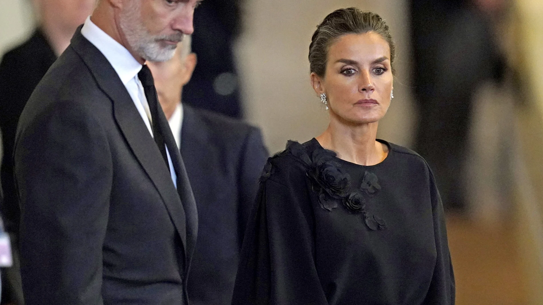 King Felipe VI and Queen Letizia of Spain look at the coffin of Queen Elizabeth II as it lies in state on the catafalque in Westminster Hall, in London, Sunday, Sept. 18, 2022. ( Jacob King/Pool Photo via AP)