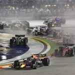 Red Bull driver Sergio Perez of Mexico leads the field soon after the start of the Singapore Formula One Grand Prix, at the Marina Bay City Circuit in Singapore, Sunday, Oct.2, 2022. (AP Photo/Danial Hakim)