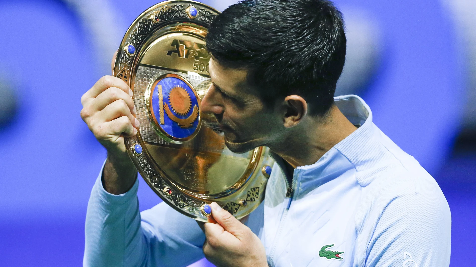 Serbia's Novak Djokovic poses with the trophy after winning the final tennis match of the ATP 500 Astana Open tennis tournament against Stefanos Tsitsipas of Greece in Astana, Kazakhstan, Sunday, Oct. 9, 2022. (AP Photo/Stas Filippov)