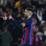 Barcelona&#39;s Jordi Alba celebrates after scoring his side&#39;s opening goal during a Spanish La Liga soccer match between Barcelona and Sevilla at the Camp Nou stadium in Barcelona. 