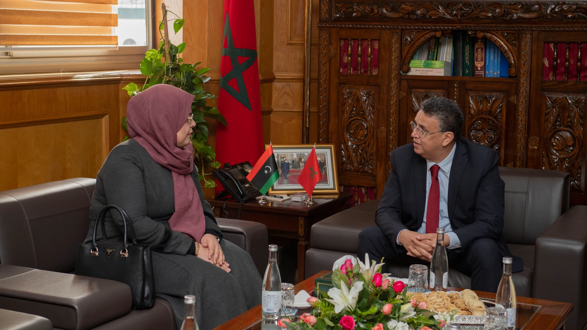 Rabat (Morocco), 13/02/2023.- Abdellatif Wahbi (R), Morocco's Minister of Justice, and his counterpart from Libya, Halima Abdel Rahman (L), hold a meeting in Rabat Morocco, 13 February 2023. Abdel Rahman is on a working visit to Morocco. (Libia, Marruecos) EFE/EPA/JALAL MORCHIDI