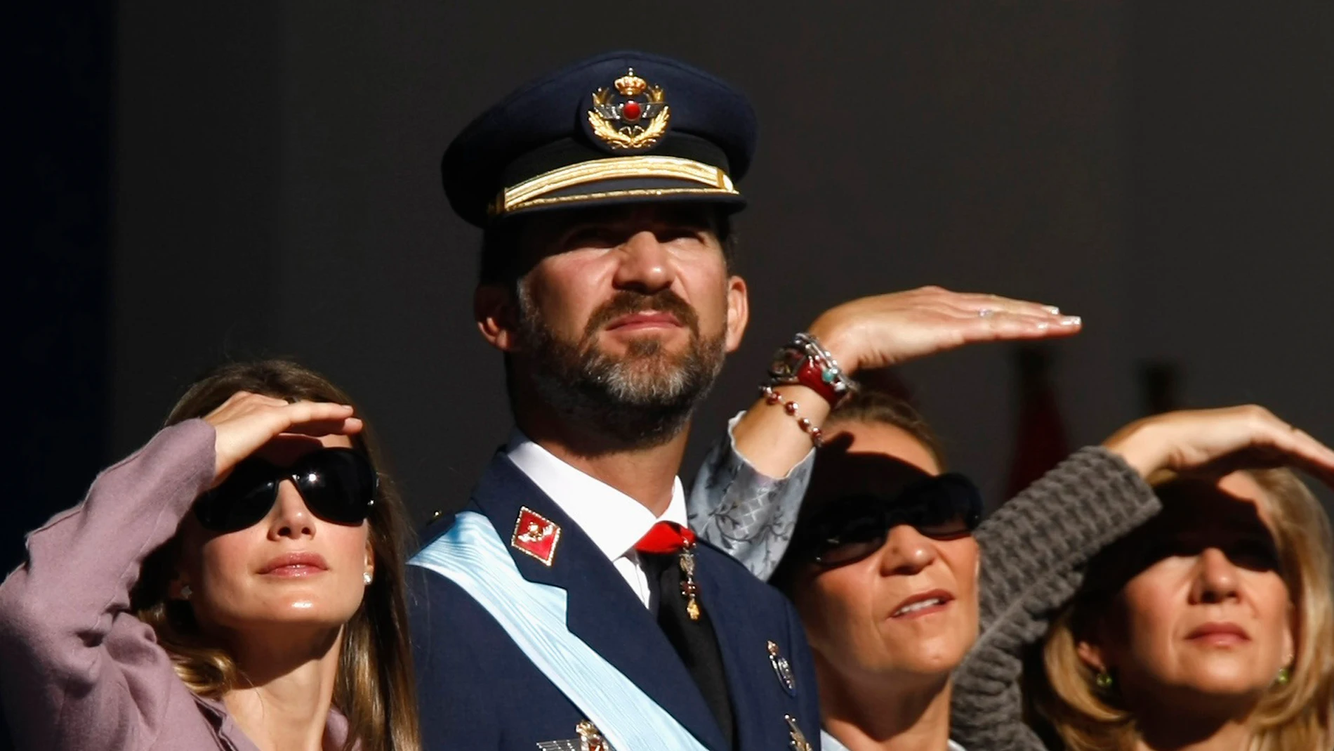 Members of the Spanish royal family (L-R) Princess Letizia, Crown Prince Felipe, Infanta Elena, Infanta Cristina and King Juan Carlos watch a military parade during Spain's National Day in Madrid October 12, 2009.