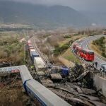 Firefighters and rescuers operate after a collision in Tempe, about 376 kilometres north of Athens, near Larissa city, Greece, . A train carrying hundreds of passengers has collided with an oncoming freight train in northern Greece, killing and injuring dozens passengers