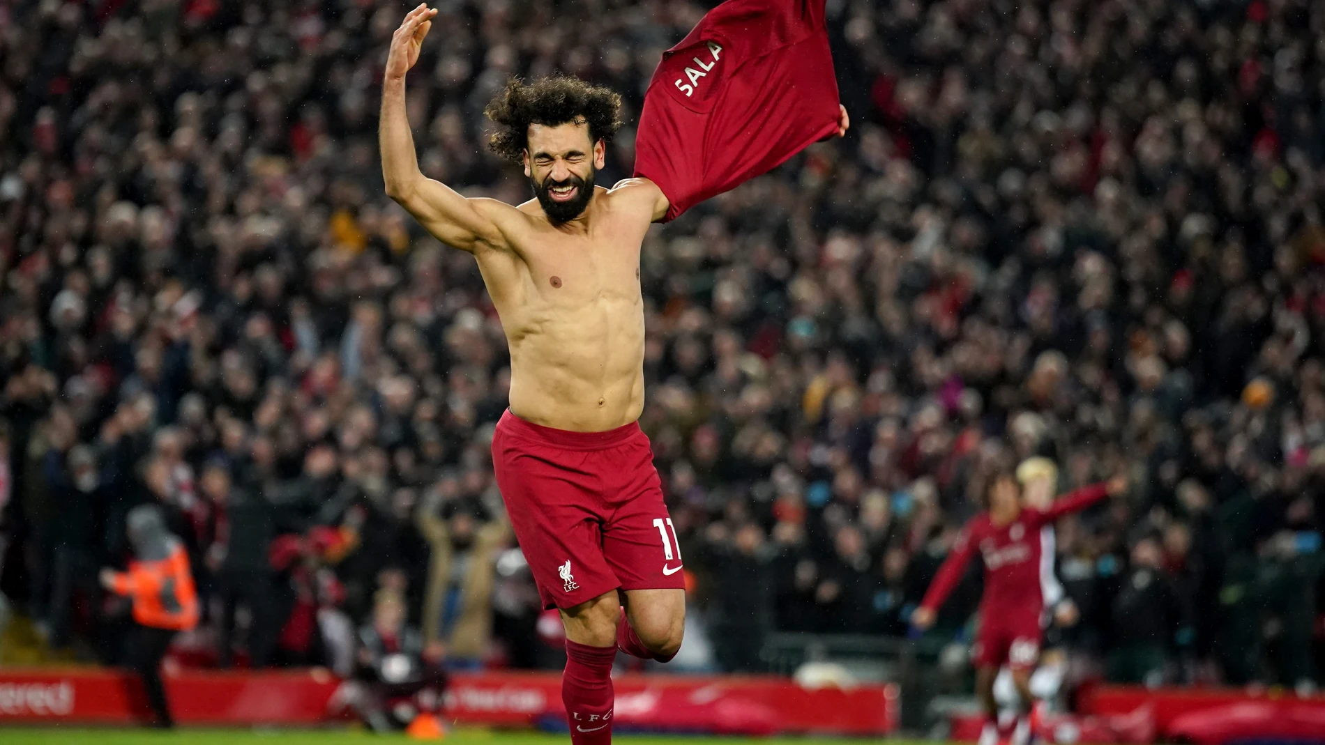 05 March 2023, United Kingdom, Liverpool: Liverpool's Mohamed Salah takes off his shirt to celebrate scoring his side's sixth goal during the English Premier League soccer match between Liverpool and Manchester United at the Anfield. Photo: Peter Byrne/PA Wire/dpa05/03/2023 ONLY FOR USE IN SPAIN