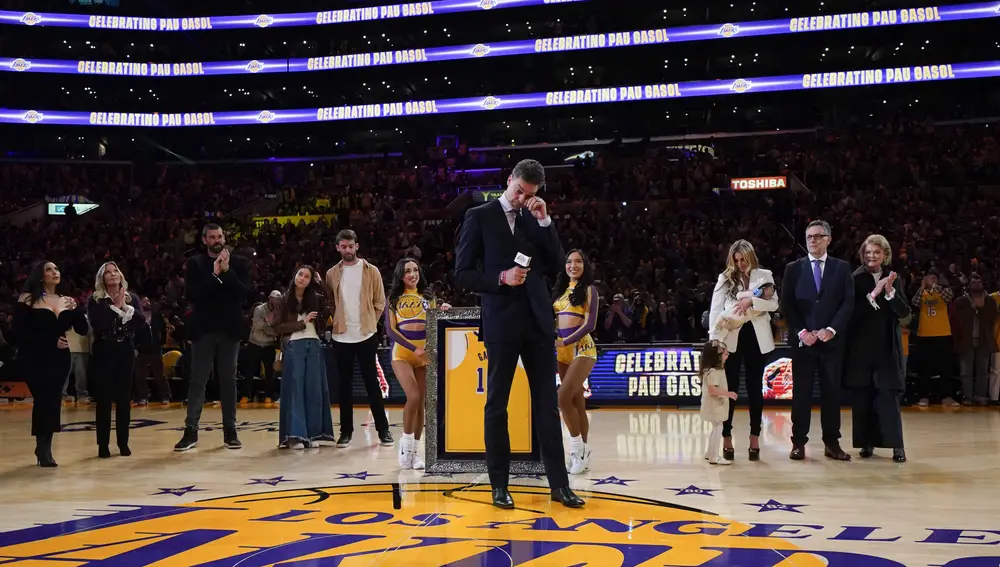 Former Los Angeles Lakers forward Pau Gasol wipes his tears while speaking at his jersey retirement ceremony during halftime of the team's NBA basketball game against the Memphis Grizzlies
