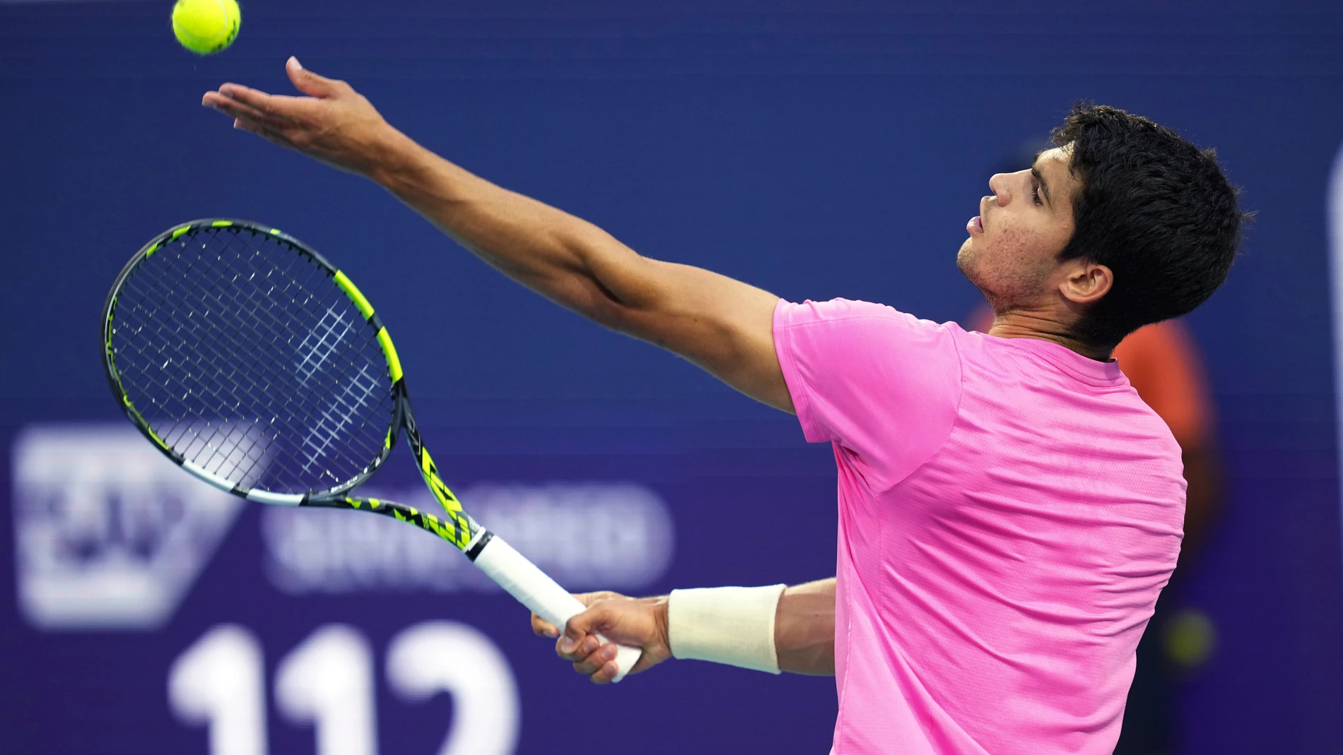 Carlos Alcaraz, of Spain, tosses the ball for a serve to Taylor Fritz, of the United States, at the Miami Open tennis tournament Thursday, March 30, 2023, in Miami Gardens, Fla. (AP Photo/Jim Rassol)