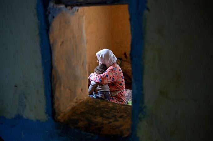 Hayat (L), grand mother of tenage girl Sana sits with her great grandson in their home in the outskirts of the city of Tiflet, Northwestern Morocco, 04 April 2023. (Issued 12 April 2023) Sana, who is now thirteen, was raped when she was 11 year old by three men and became pregnant with a boy. Overcoming fears of reprisal as the rapists live near her house, the father lodged a complaint against them, and the court sentenced them on 06 April to a year and a half and two years in prison. The length of the sentences raised indignation as the Moroccan law normally stipulates five to ten years prison term which can go up to twenty if the victim is a minor. According to a study prepared in 2020 by the femminist group Masaktach (I won't keep quiet in Arabic), analyzing 1,169 cases from the 21 First Istance Courts in Morocco: 80 per cent of those convicted of rape receive a sentence of less than five years and in practice they are in prison for an average of three years and one month. (Marruecos) 