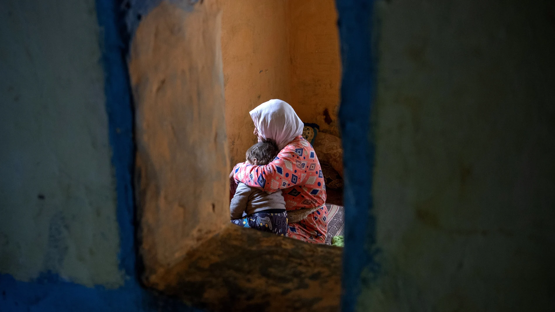 Hayat (L), grand mother of tenage girl Sana sits with her great grandson in their home in the outskirts of the city of Tiflet, Northwestern Morocco, 04 April 2023. (Issued 12 April 2023) Sana, who is now thirteen, was raped when she was 11 year old by three men and became pregnant with a boy. Overcoming fears of reprisal as the rapists live near her house, the father lodged a complaint against them, and the court sentenced them on 06 April to a year and a half and two years in prison. The length of the sentences raised indignation as the Moroccan law normally stipulates five to ten years prison term which can go up to twenty if the victim is a minor. According to a study prepared in 2020 by the femminist group Masaktach (I won't keep quiet in Arabic), analyzing 1,169 cases from the 21 First Istance Courts in Morocco: 80 per cent of those convicted of rape receive a sentence of less than five years and in practice they are in prison for an average of three years and one month. (Marruecos) 