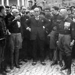 Italian Fascist leader Benito Mussolini, center, hands on hips, with members of the Fascist Party, in Rome, Italy, Oct. 28, 1922, following their March on Rome.