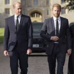 Britain's Prince William, Prince of Wales, left and Prince Harry walk to meet members of the public at Windsor Castle, following the death of Queen Elizabeth II 