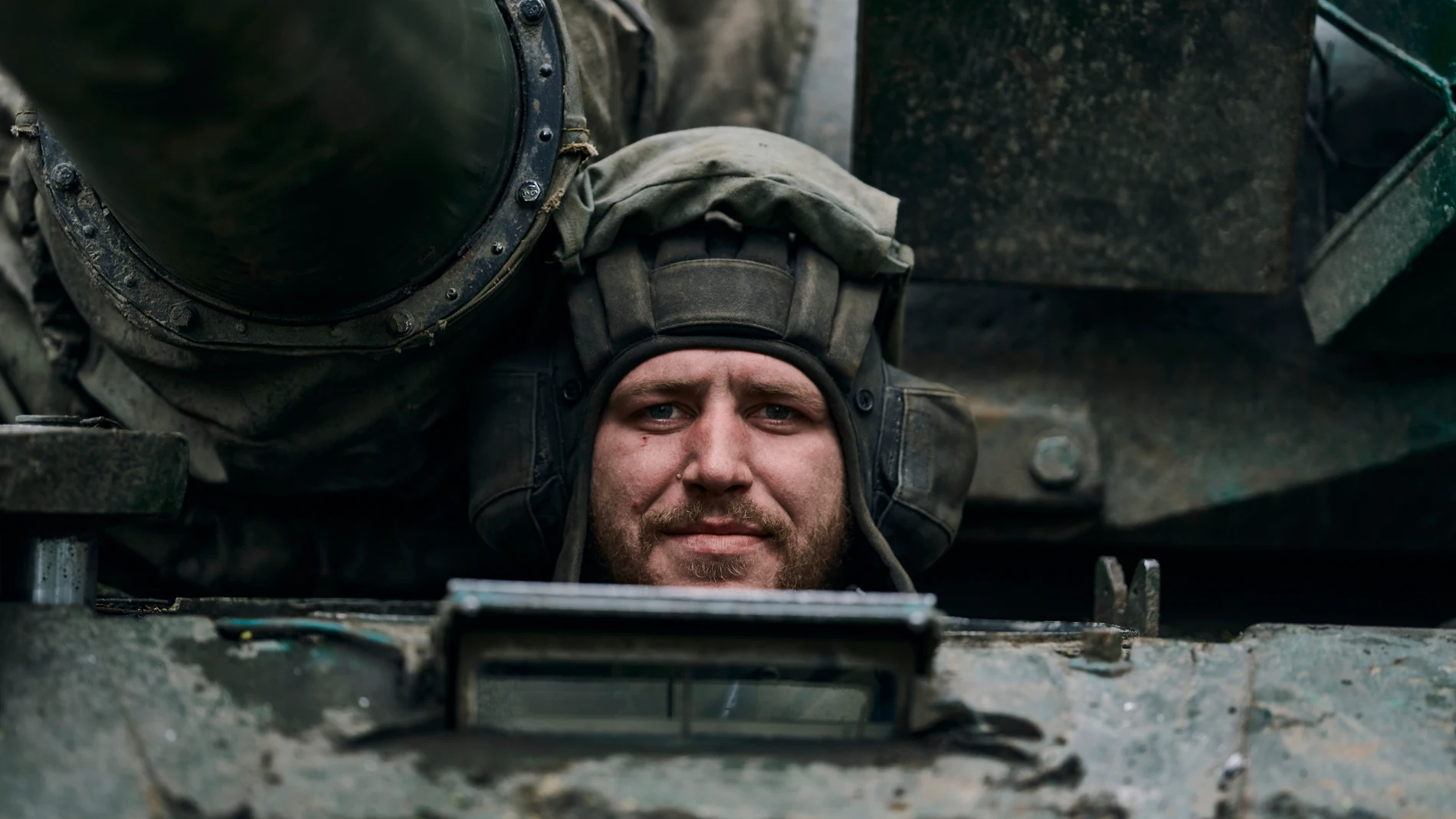 A Ukrainian soldier looks out of a tank on the frontline in Bakhmut, Donetsk region, Ukraine, Sunday, April 23, 2023. (AP Photo/Libkos)