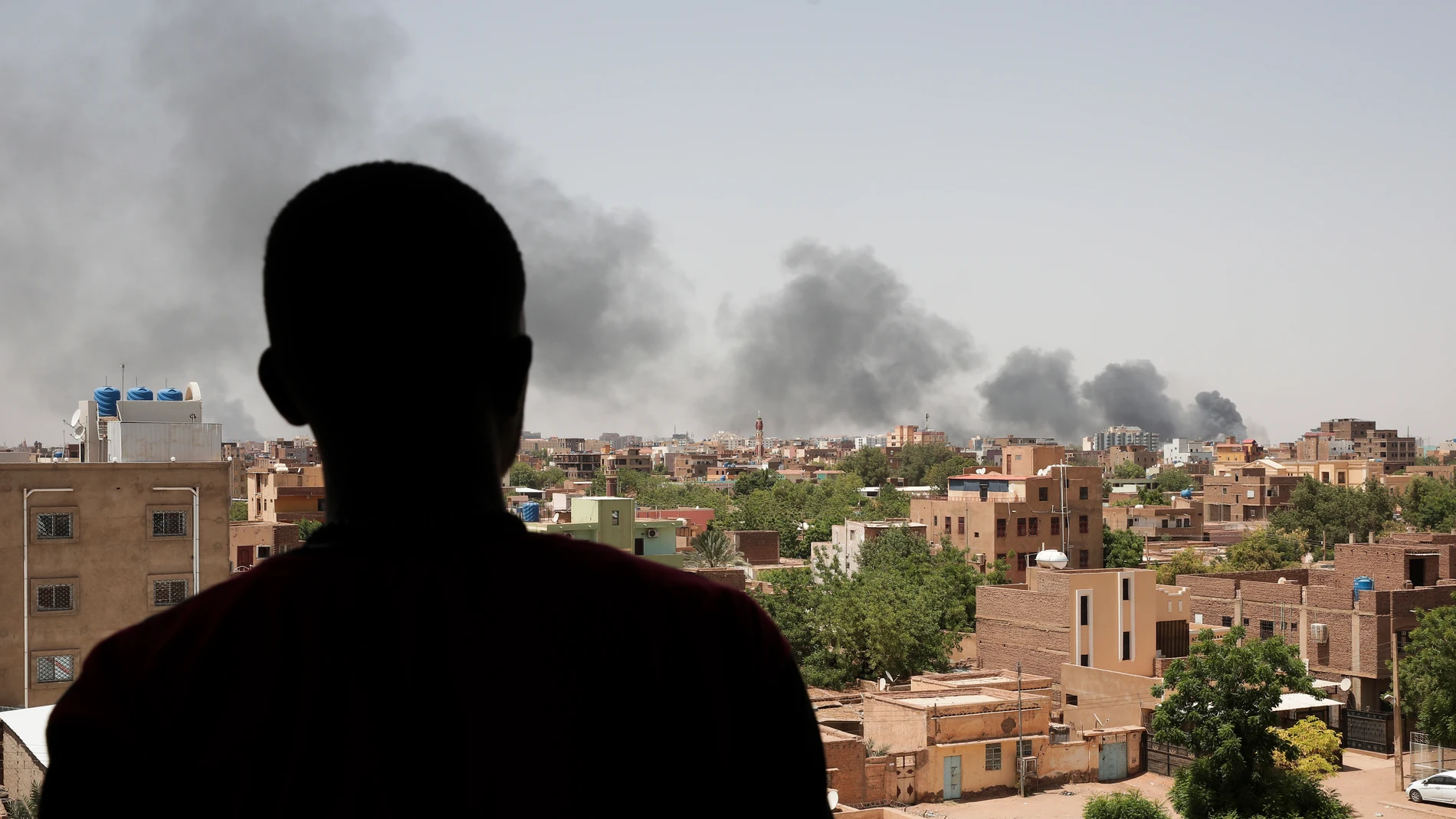 FILE - Smoke is seen in Khartoum, Sudan, Saturday, April 22, 2023. Khartoum, a city of some 5 million people, has been transformed into a front line in the grinding conflict between Gen. Abdel Fattah Burhan, the commander of Sudan’s military, and Gen. Mohammed Hamdan Dagalo, who leads the powerful paramilitary group known as the Rapid Support Forces. The outbreak of violence has dashed once-euphoric hopes for a democratic transition in Sudan after a popular uprising helped oust former dictator Omar al-Bashir. (AP Photo/Marwan Ali, File)