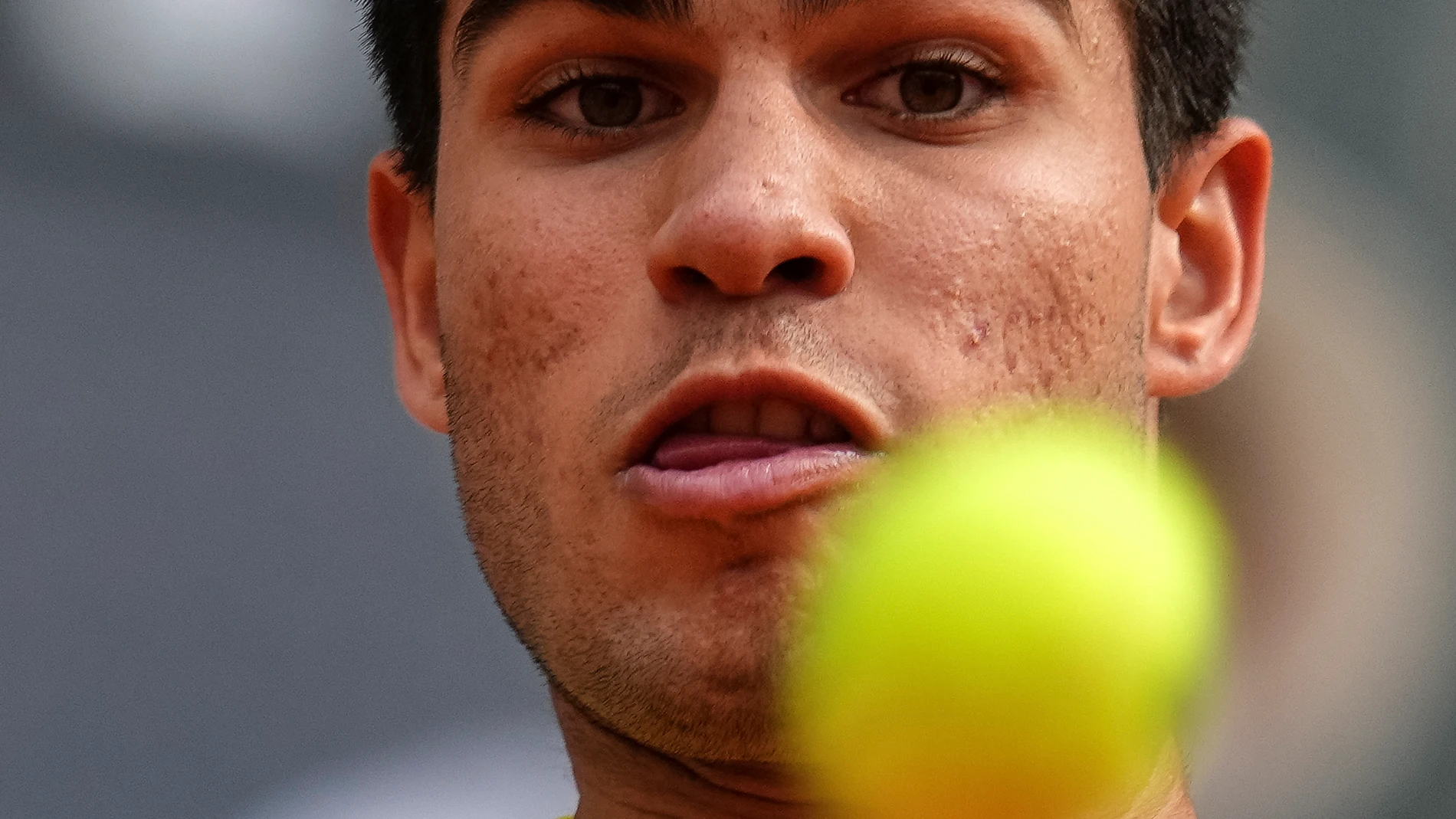 Carlos Alcaraz, of Spain, eyes the ball during his match against Alexander Zverev, of Germany, at the Madrid Open tennis tournament in Madrid, Spain, Tuesday, May 2, 2023. (AP Photo/Manu Fernandez)