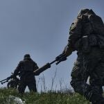 Ukrainian army snipers change their position facing Russian troops near Bakhmut, Donetsk region, Ukraine, Tuesday, May 2, 2023. 