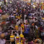 FILE - People crowd a market on the eve of of Dussehra festival in Mumbai, India, Oct. 4, 2022. Demographers are unsure exactly when India will take the title as the most populous nation in the world because they&#39;re relying on estimates to make their best guess.