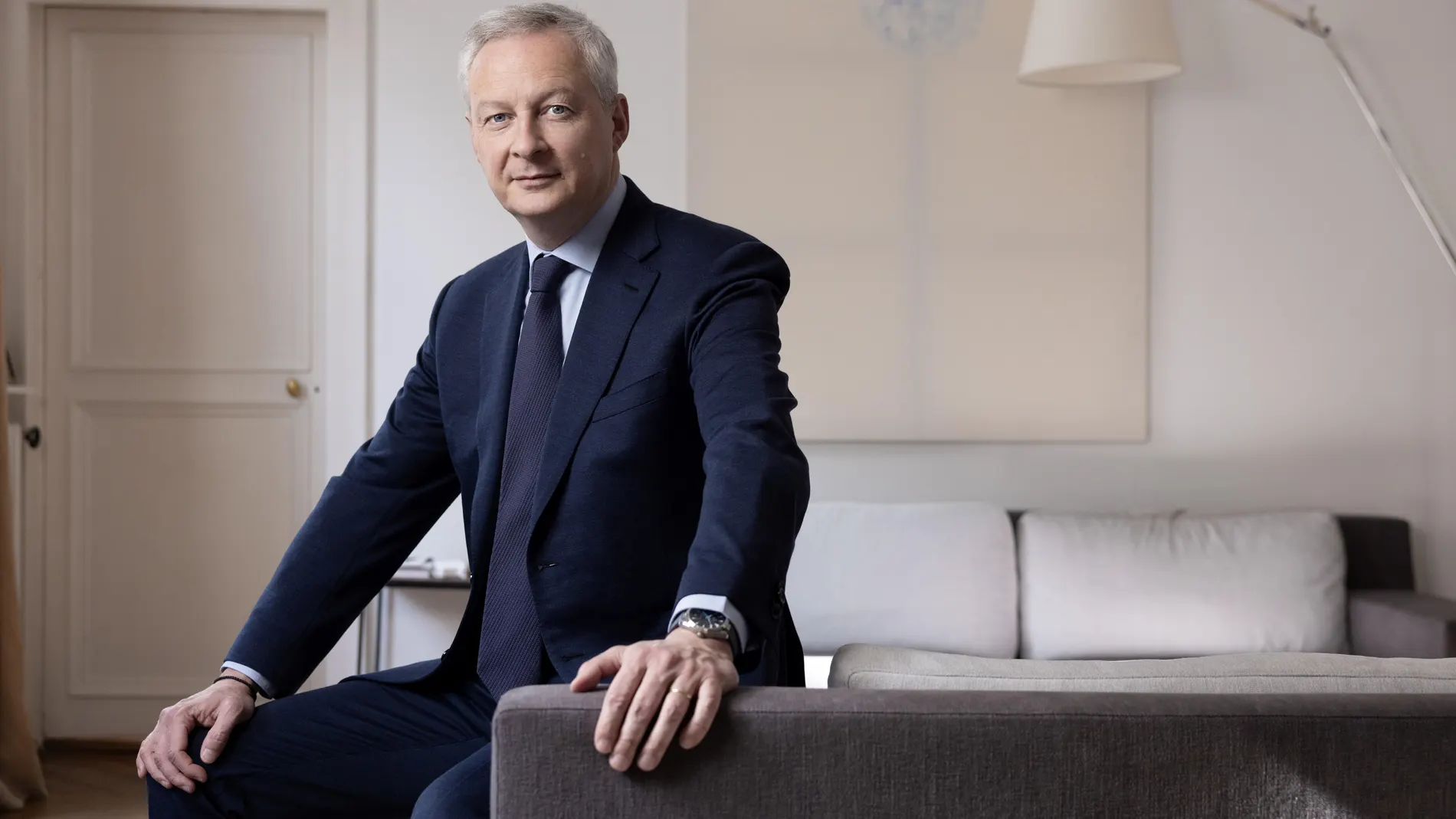 French Minister for the Economy and Finances Bruno Le Maire poses during a photo session at his home in Paris on April 27, 2023. 