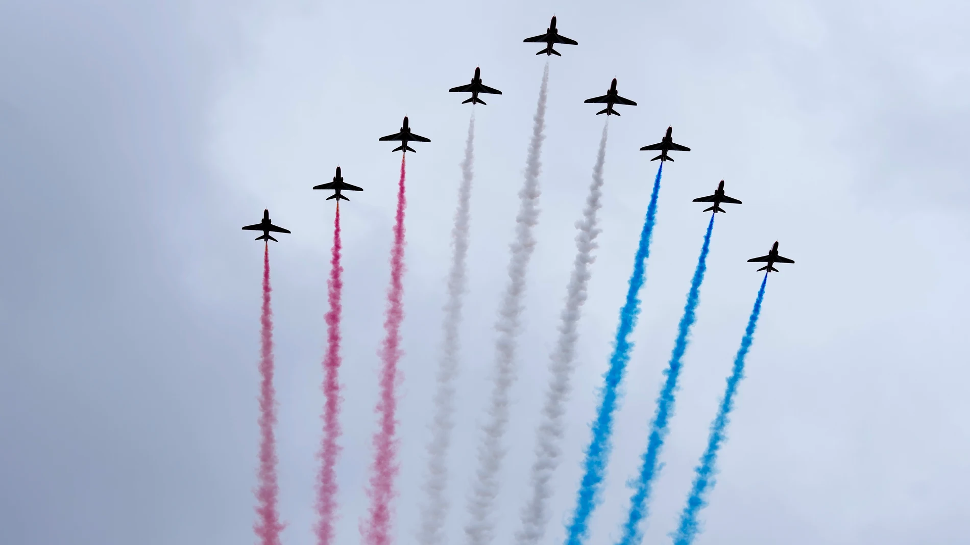 The Red Arrows fly over Buckingham Palace as members of the royal family stand on the balcony after the coronation of Britain's King Charles III in London, Saturday, May 6, 2023. (AP Photo/Peter Dejong, Pool)