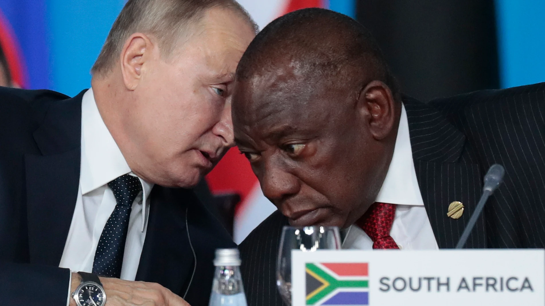 FILE - Russian President Vladimir Putin, left, speaks to South African President, Cyril Ramaphosa, right, during a plenary session at the Russia-Africa summit in the Black Sea resort of Sochi, Russia on Oct. 24, 2019. The U.S. ambassador to South Africa, Reuben Brigety, has accused South Africa of providing weapons to Russia saying the U.S. government was certain that weapons were loaded onto a cargo ship that docked secretly at a naval base near the city of Cape Town for three days in December. (Sergei Chirikov/Pool Photo via AP, File)