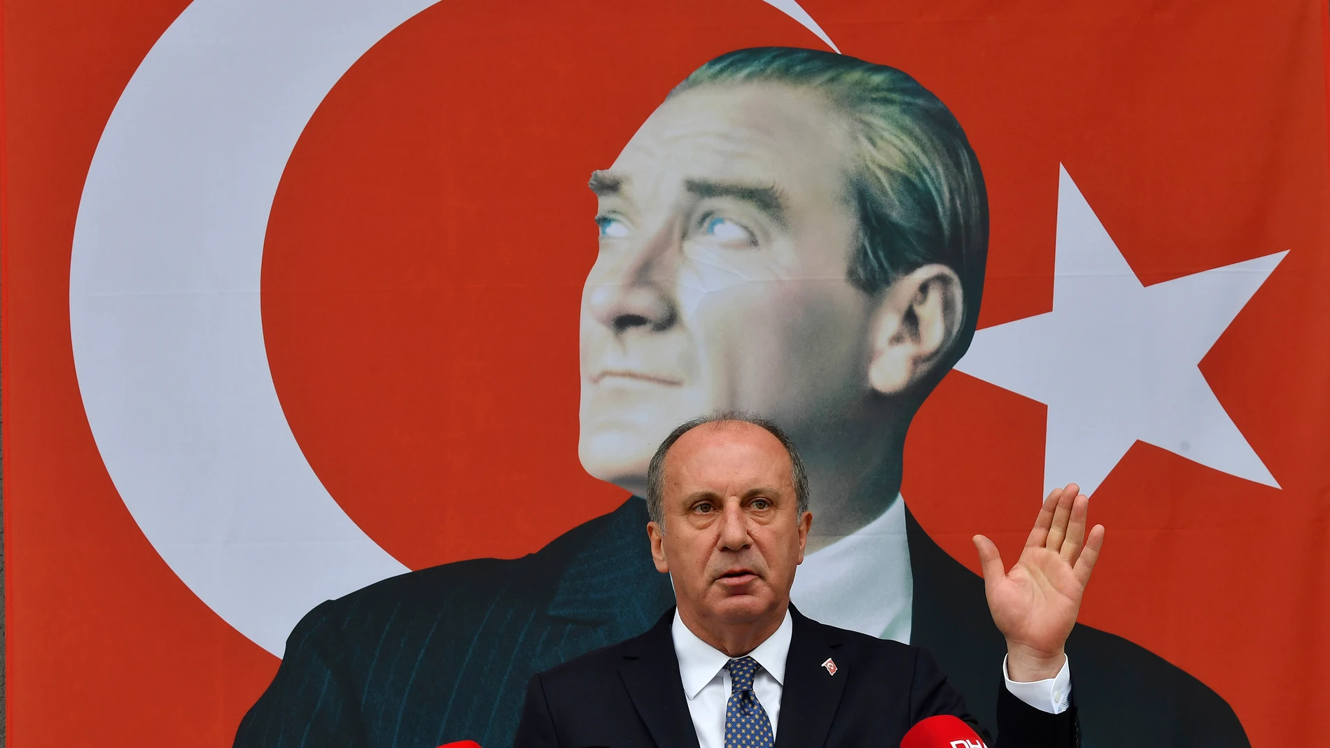 FILE - Muharrem Ince gestures as he announces his resignation from Turkey's main opposition party, CHP, during a media conference next to a poster of modern Turkey's founder, Mustafa Kemal Ataturk, in Ankara, Turkey, Monday, Feb. 8, 2021. Muharrem Ince, the leader of the center-left Homeland Party, a candidate in Sunday's elections announced Thursday, May 11, 2023 that he is withdrawing from the presidential race, in a move that is likely to bolster President Recep Tayyip Erdogan's main challenger. (AP Photo/File)