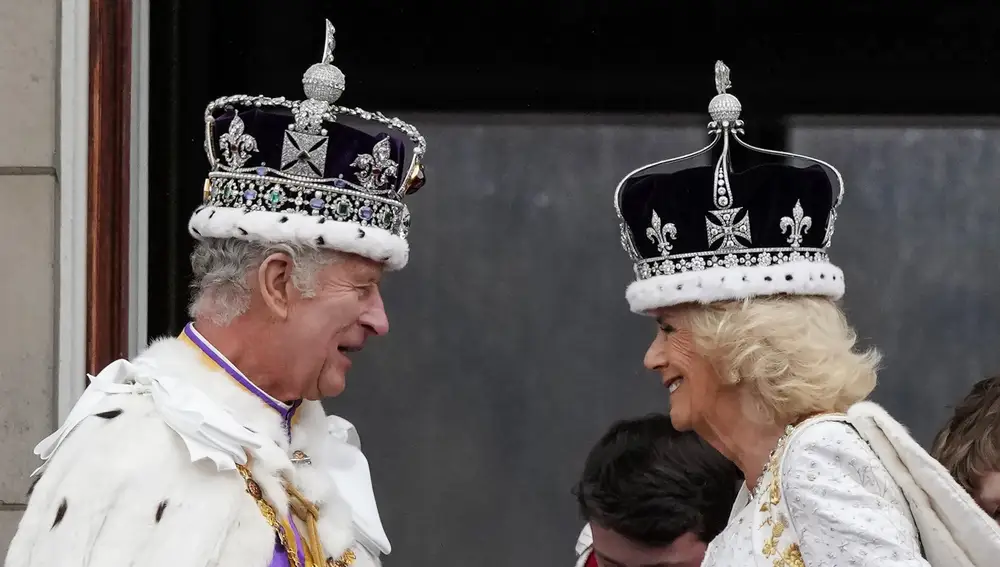 Britain's King Charles III and Queen Camilla smile on the balcony of Buckingham Palace after the coronation ceremony in London, Saturday, May 6, 2023. 