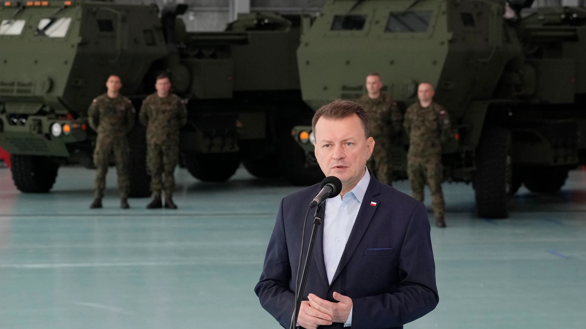 Poland's Defense Minister Mariusz Blaszczak speaks during ceremony after receiving its first shipment of U.S.-made HIMARS rocket launchers, at an air base in Warsaw, Poland, on Monday, 15 May 2023. Poland has received its first shipment of U.S.-made HIMARS rocket launchers, part of an upgrade of its defenses amid security concerns due to the war in neighboring Ukraine. (AP Photo/Czarek Sokolowski)