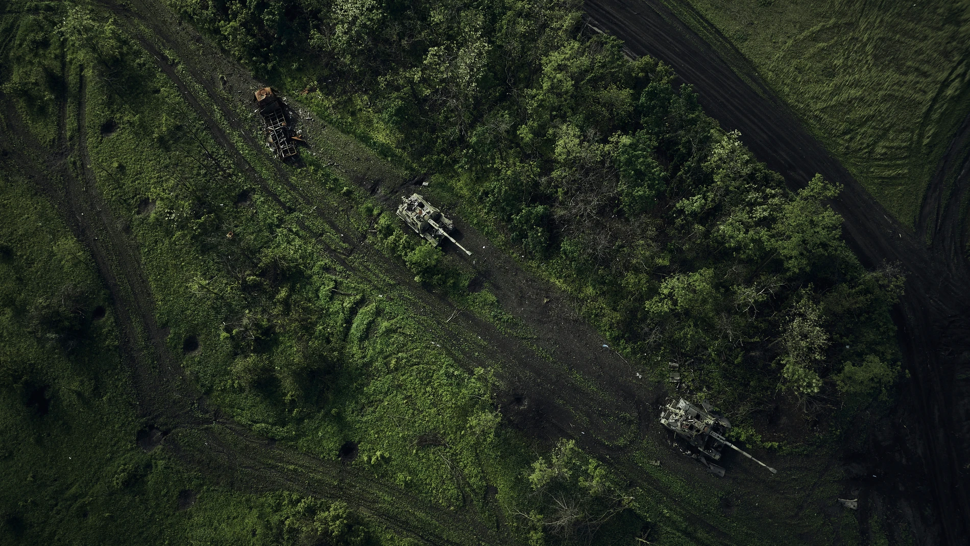 An aerial view of a battle field with damaged Russian tanks near Bakhmut in the Donetsk region, Ukraine, Saturday, May 27, 2023. (AP Photo/Libkos)