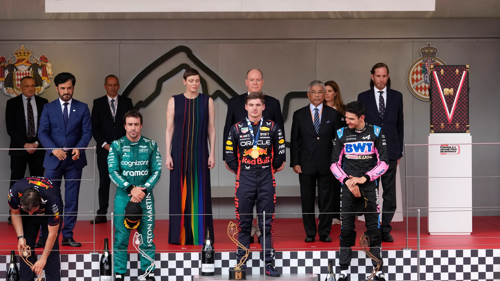 First place, Red Bull driver Max Verstappen of the Netherlands, center, poses on the podium with second place, Aston Martin driver Fernando Alonso of Spain and third place Alpine driver Esteban Ocon of France during the Monaco Formula One Grand Prix, at the Monaco racetrack, in Monaco, Sunday, May 28, 2023. (AP Photo/Luca Bruno)