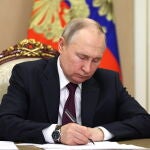 Russian President Vladimir Putin chairs a meeting with members of the government in Moscow
