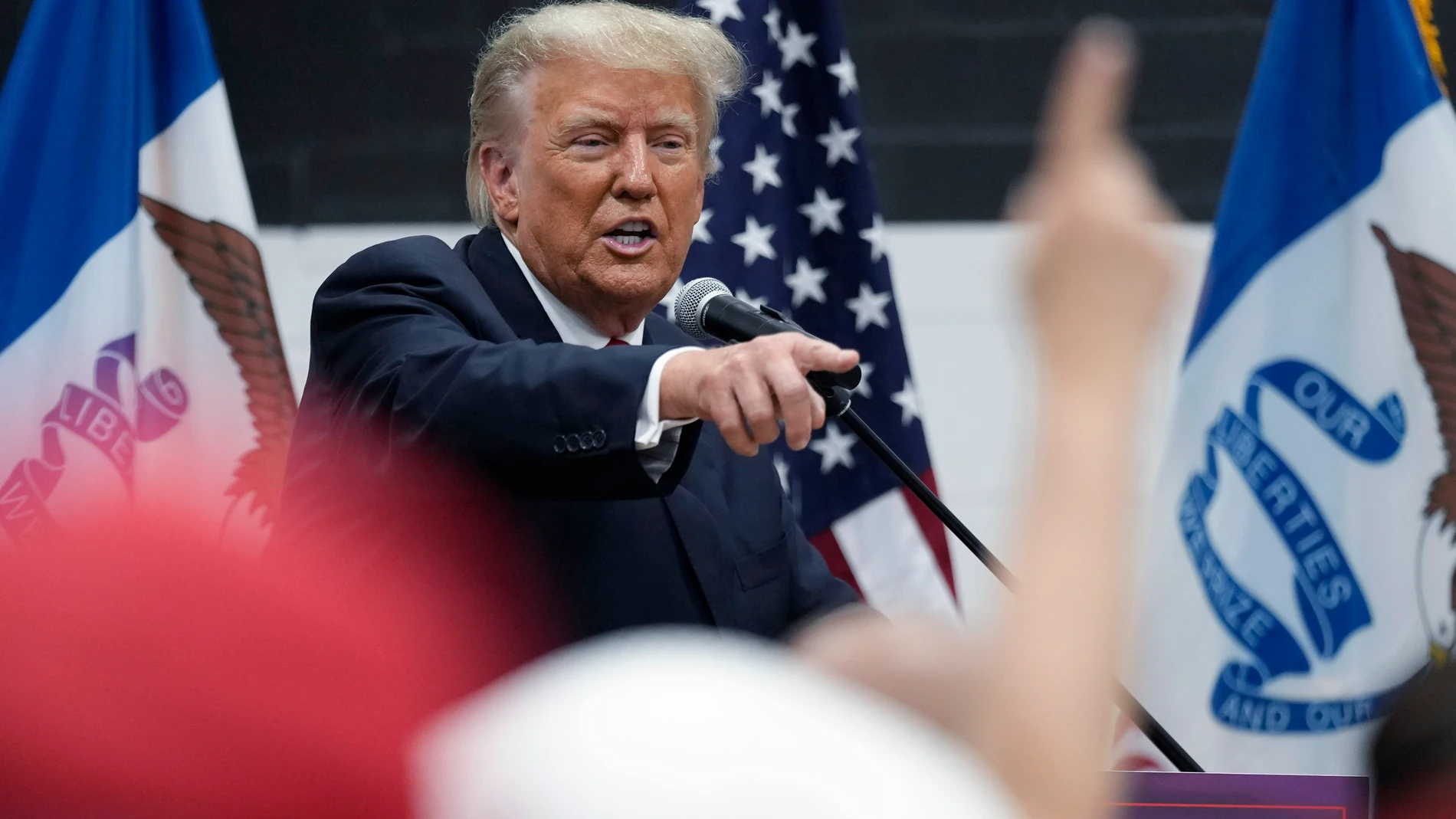 Former President Donald Trump visits with campaign volunteers at the Grimes Community Complex Park, Thursday, June 1, 2023, in Des Moines, Iowa. (AP Photo/Charlie Neibergall)