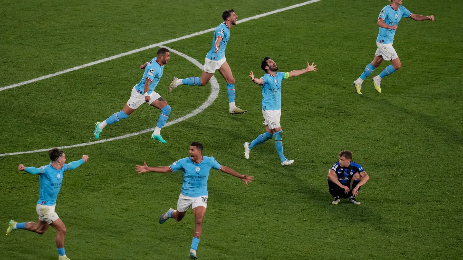 Manchester City players celebrate their 1-0 win at the end of the Champions League final soccer match between Manchester City and Inter Milan at the Ataturk Olympic Stadium in Istanbul, Turkey, Saturday, June 10, 2023. (AP Photo/Thanassis Stavrakis)