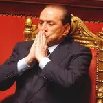 Italian Premier Silvio Berlusconi gestures after his address at a session in the Senate, in Rome in this Wednesday March 9, 2005 file photo.