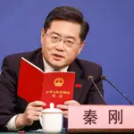 Chinese Foreign Minister Qin Gang reads from China's constitution after a question about Taiwan during a press conference in Beijing, China.