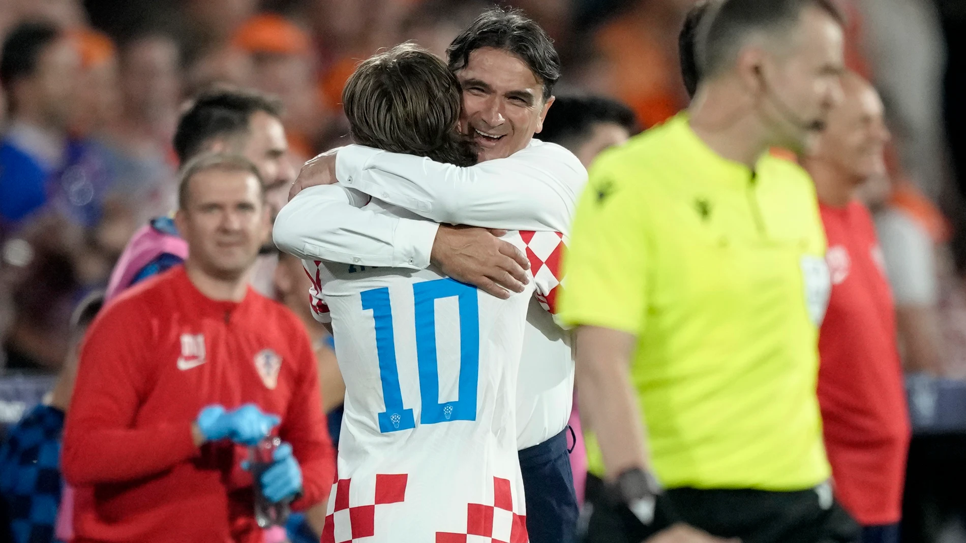 Croatia's Luka Modric, left, celebrates with coach Zlatko Dalic after scoring their fourth goal from the penalty spot during the Nations League semifinal soccer match between the Netherlands and Croatia at De Kuip stadium in Rotterdam, Netherlands, Wednesday, June 14, 2023. (AP Photo/Peter Dejong)