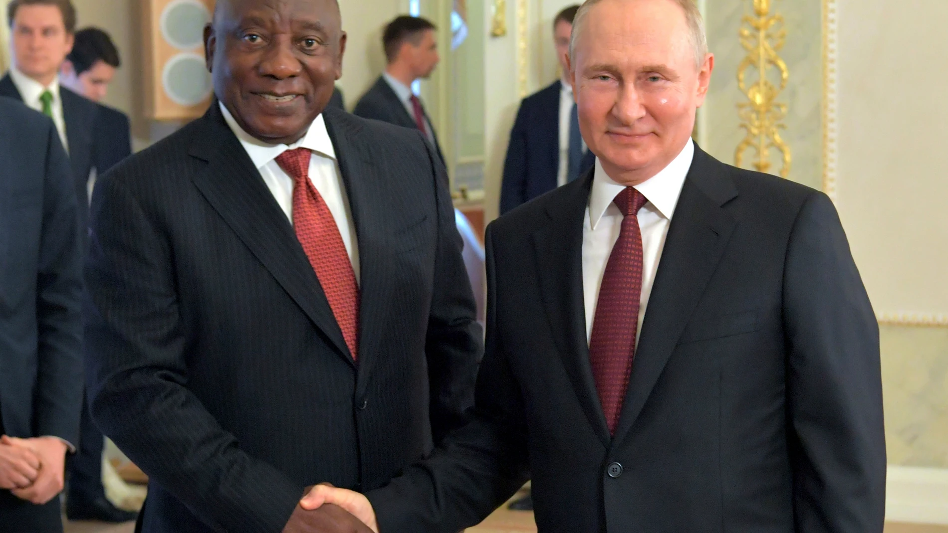 In this handout photo provided by Photo host Agency RIA Novosti, Russian President Vladimir Putin, right, and South African President Cyril Ramaphosa pose for a photo during a meeting with a delegation of African leaders and senior officials in St. Petersburg, Russia, Saturday, June 17, 2023. Seven African leaders — presidents of Comoros, Senegal, South Africa and Zambia, as well as Egypt's prime minister and top envoys from the Republic of Congo and Uganda — traveled to Russia on Saturday a ...