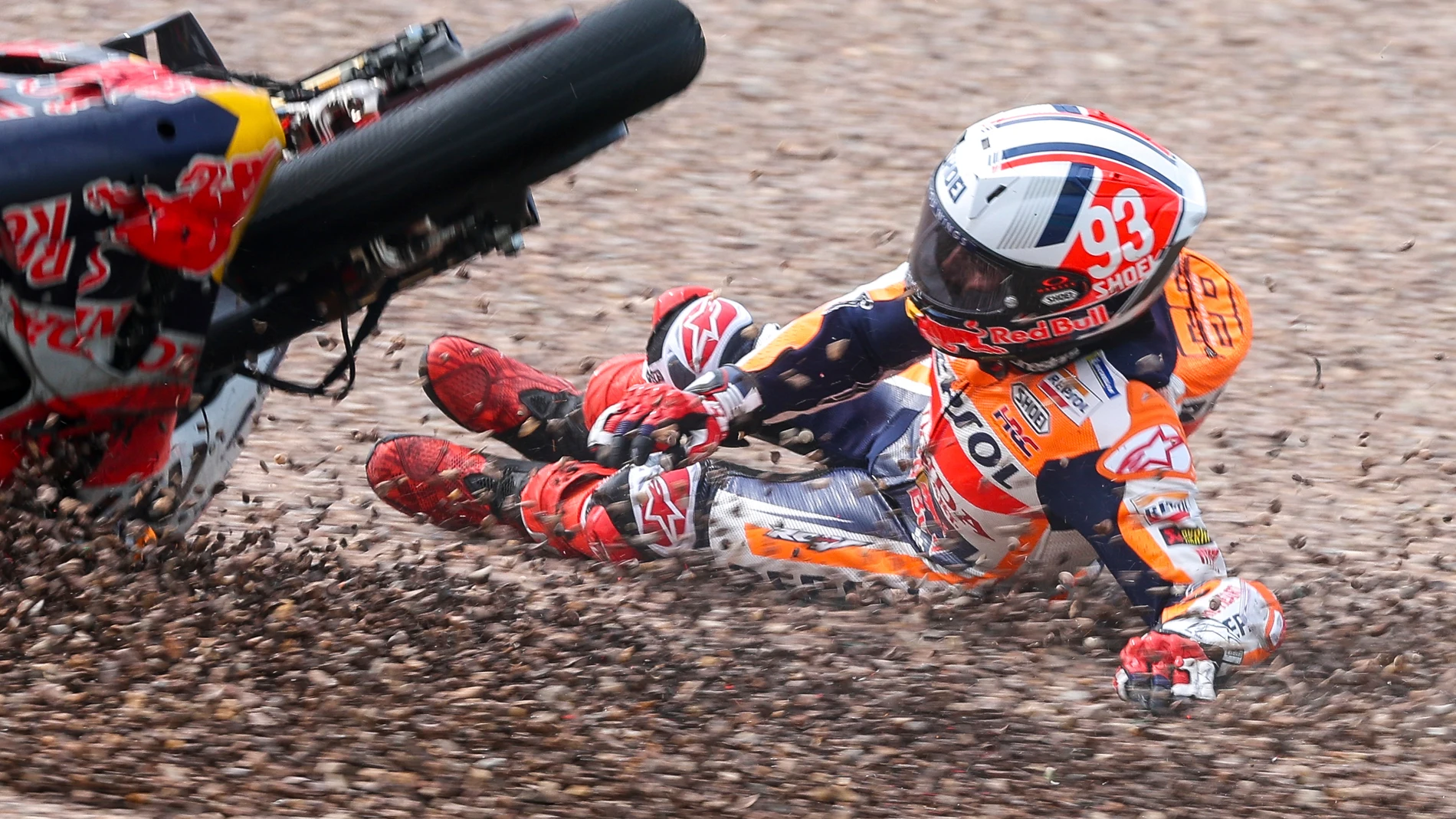 Marc Marquez from Spain on his Repsol Honda falls in the gravel during qualifying practice for the German Grand Prix at the Sachsenring in Hohenstein-Ernstthal, Germany, Saturday, June 17, 2023. (Jan Woitas//dpa via AP)