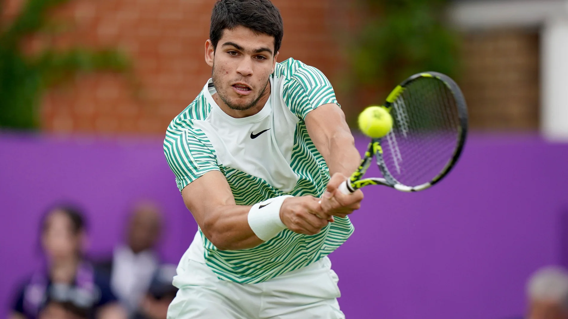 Spain's Carlos Alcaraz returns the ball to France's Arthur Fils during the Men's Singles Lucky Loser Qualifying match on day two of the 2023 cinch Championships at The Queen's Club, London, Tuesday June 20, 2023. (Adam Davy/PA via AP)