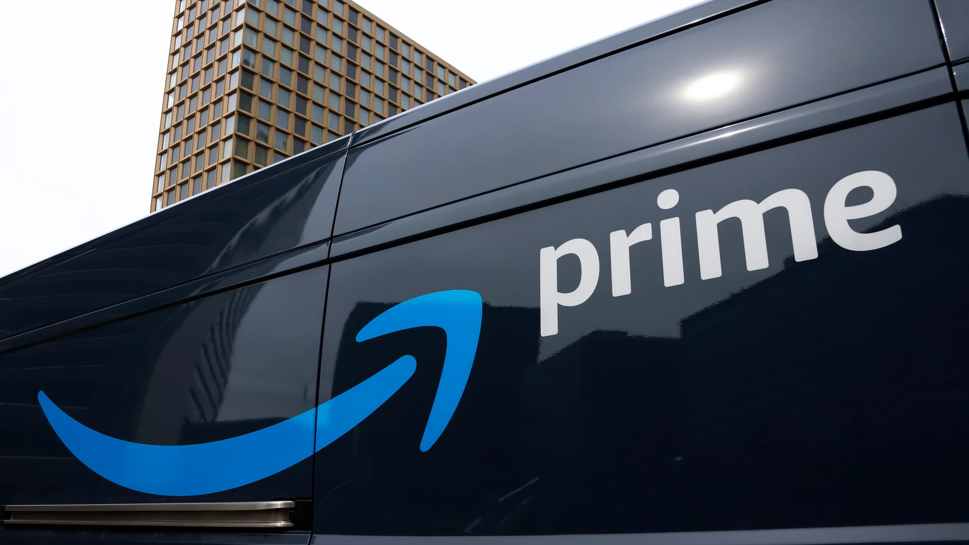 FILE - An Amazon Prime delivery vehicle is seen in downtown Pittsburgh on March 18, 2020. The Federal Trade Commission sued Amazon on Wednesday for what it called a years-long effort to enroll consumers without consent into its Prime program and making it difficult for them to cancel their subscriptions. (AP Photo/Gene J. Puskar, File)