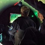 An undated handout photo released by OceanGate Expeditions shows employees working inside the submersible "Titan" used to visit the wreck site of the Titanic. Rescuers searching for a tourist submersible near the Titanic wreck in the North Atlantic have heard "noises" in the area near where the vessel went missing on Sunday.