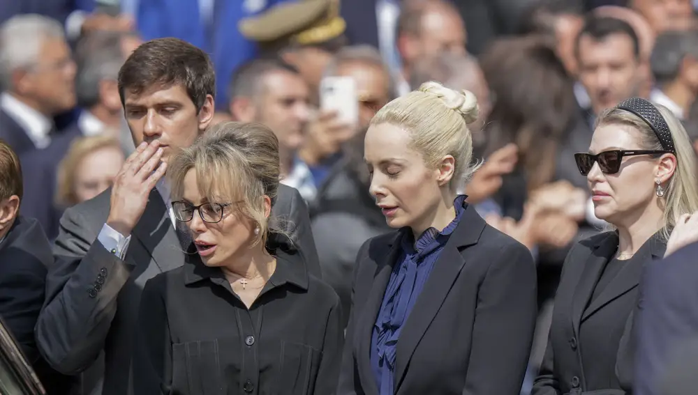 Family members of media mogul and former Italian Premier Silvio Berlusconi, from left, son Luigi, daughter Marina, partner Marta Fascina, and daughter Barbara bid the last farewell to the casket containing the body of Silvio Berlusconi at the end of his state funeral outside the Milan's Gothic Cathedral in northern Italy.