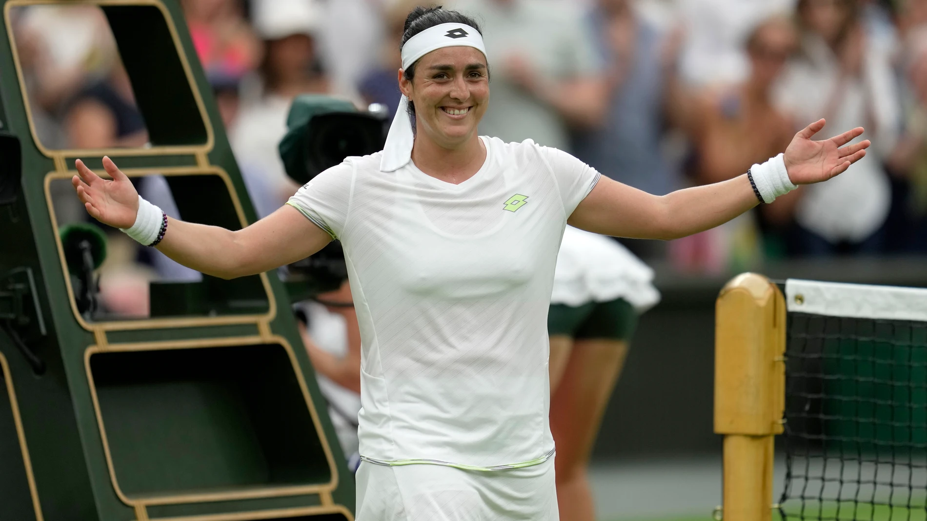 Tunisia's Ons Jabeur celebrates winning against Aryna Sabalenka of Belarus during their women's semifinal singles match on day eleven of the Wimbledon tennis championships in London, Thursday, July 13, 2023. (AP Photo/Kin Cheung)